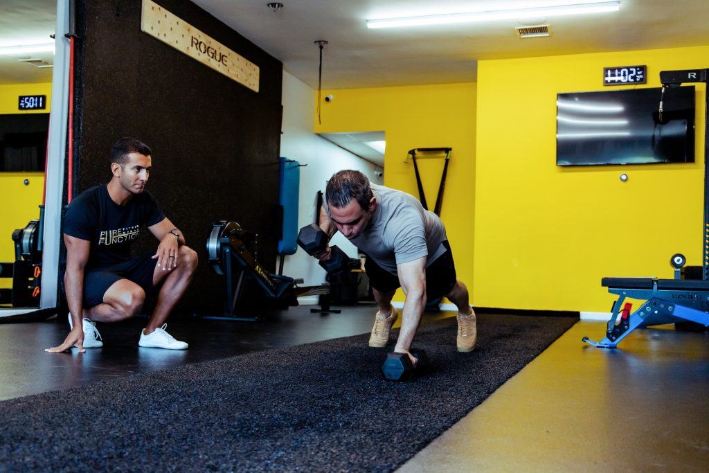 archers pushup being demonstrated by a personal trainer at pure function fitness